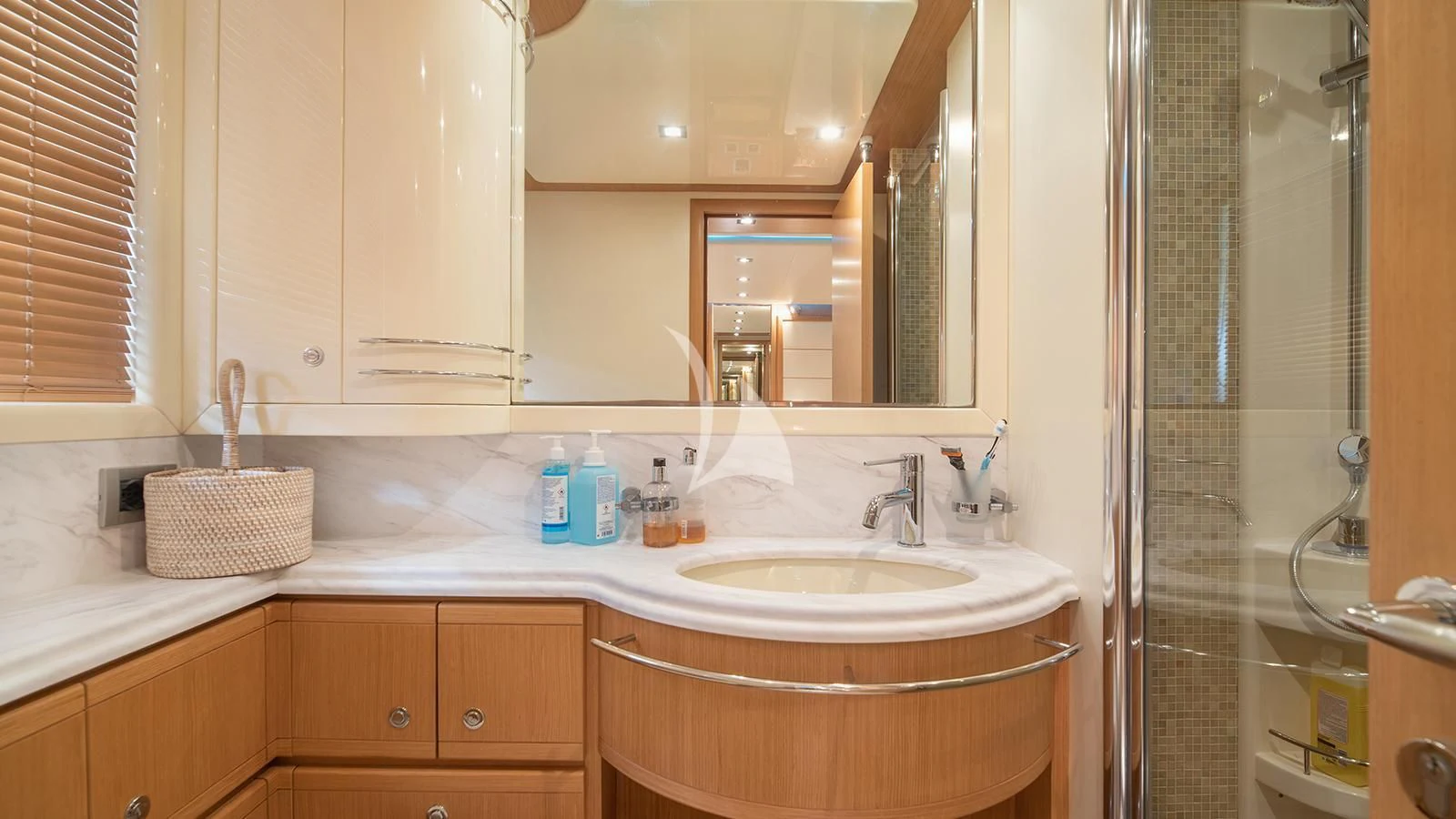 a bathroom with a sink and a mirror aboard MELI Yacht for Charter