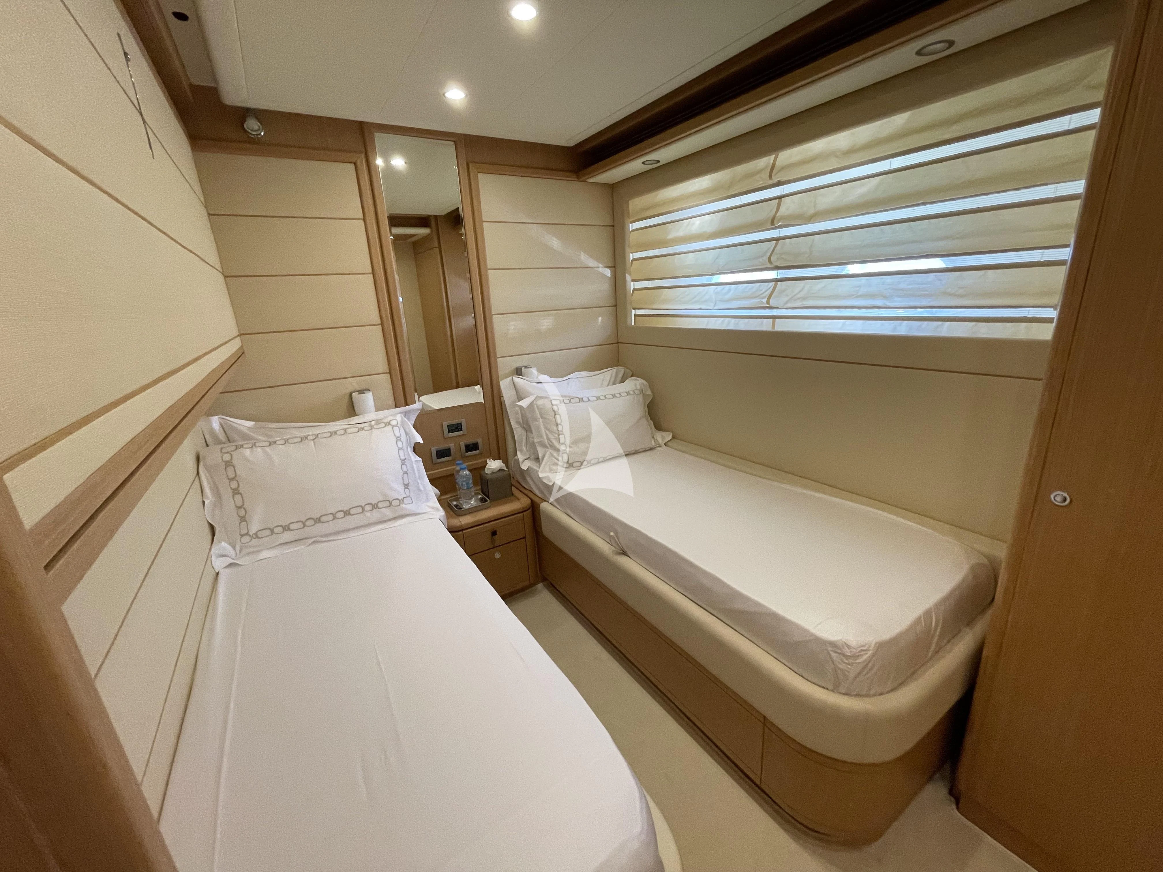 a room with two beds aboard MELI Yacht for Charter