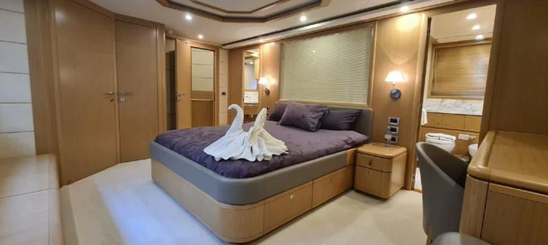 a bed in a room aboard MELI Yacht for Charter