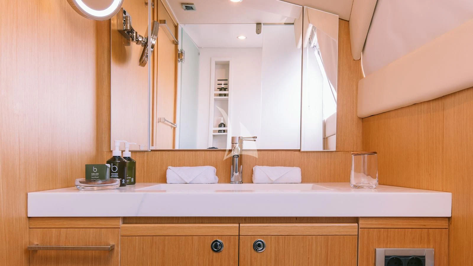 a bathroom with a large mirror aboard MELI Yacht for Charter