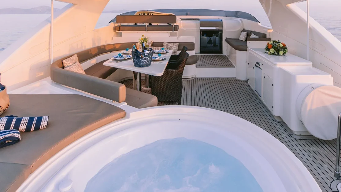 a room with a bed and a table aboard MELI Yacht for Charter