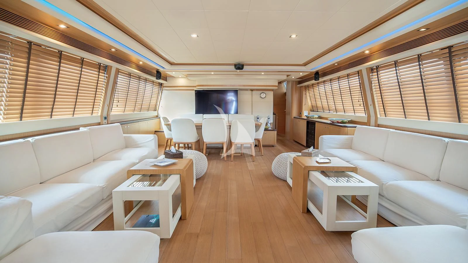 a living room with a wood floor aboard MELI Yacht for Charter