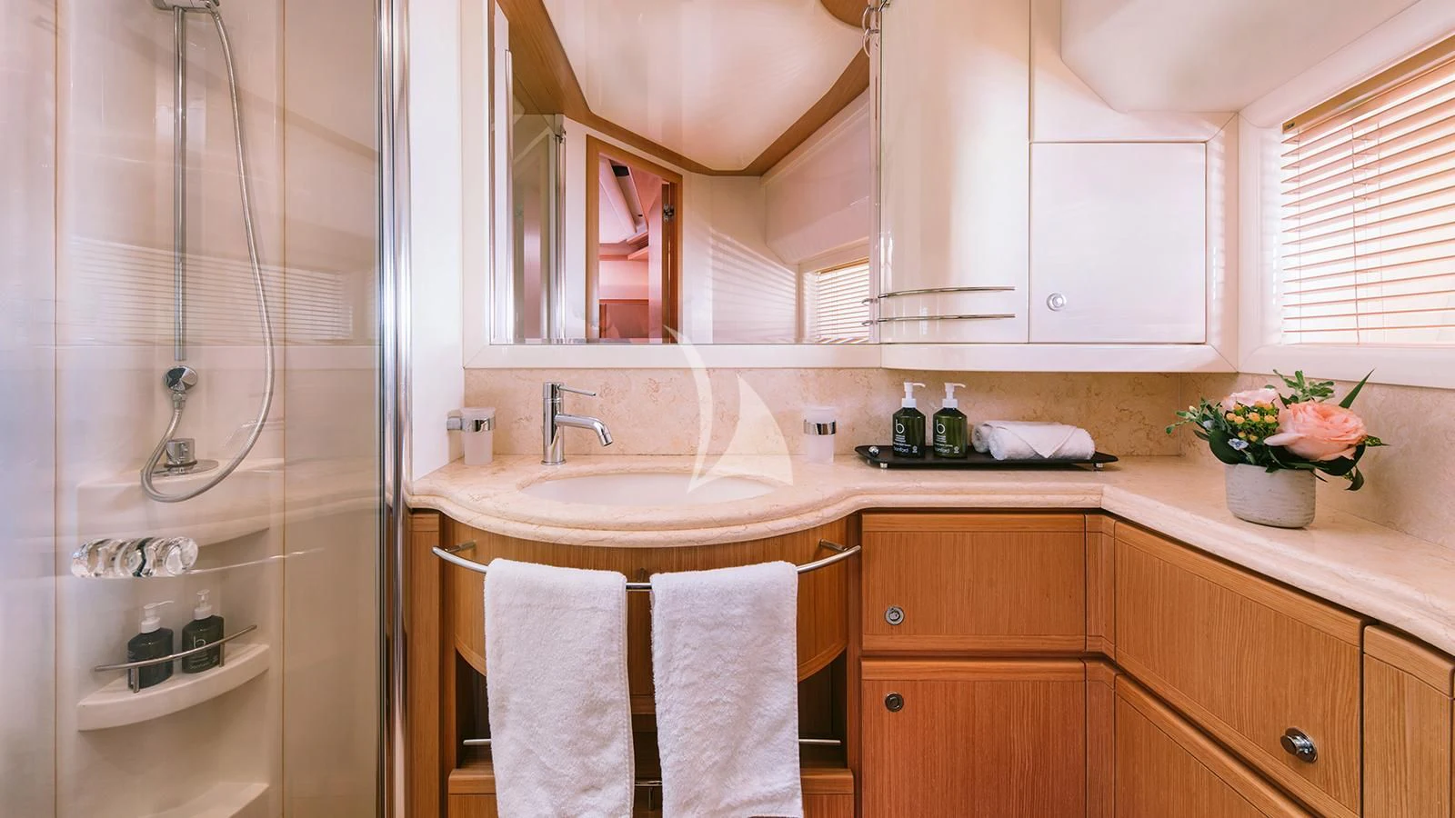 a bathroom with a sink and a mirror aboard MELI Yacht for Charter