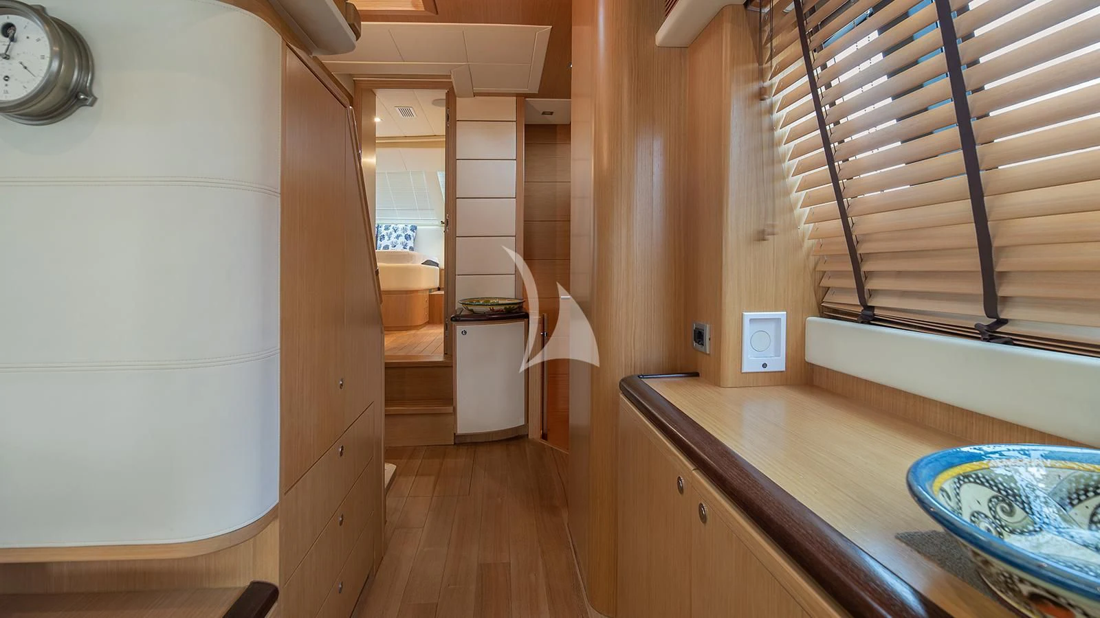 a kitchen with wooden cabinets aboard MELI Yacht for Charter