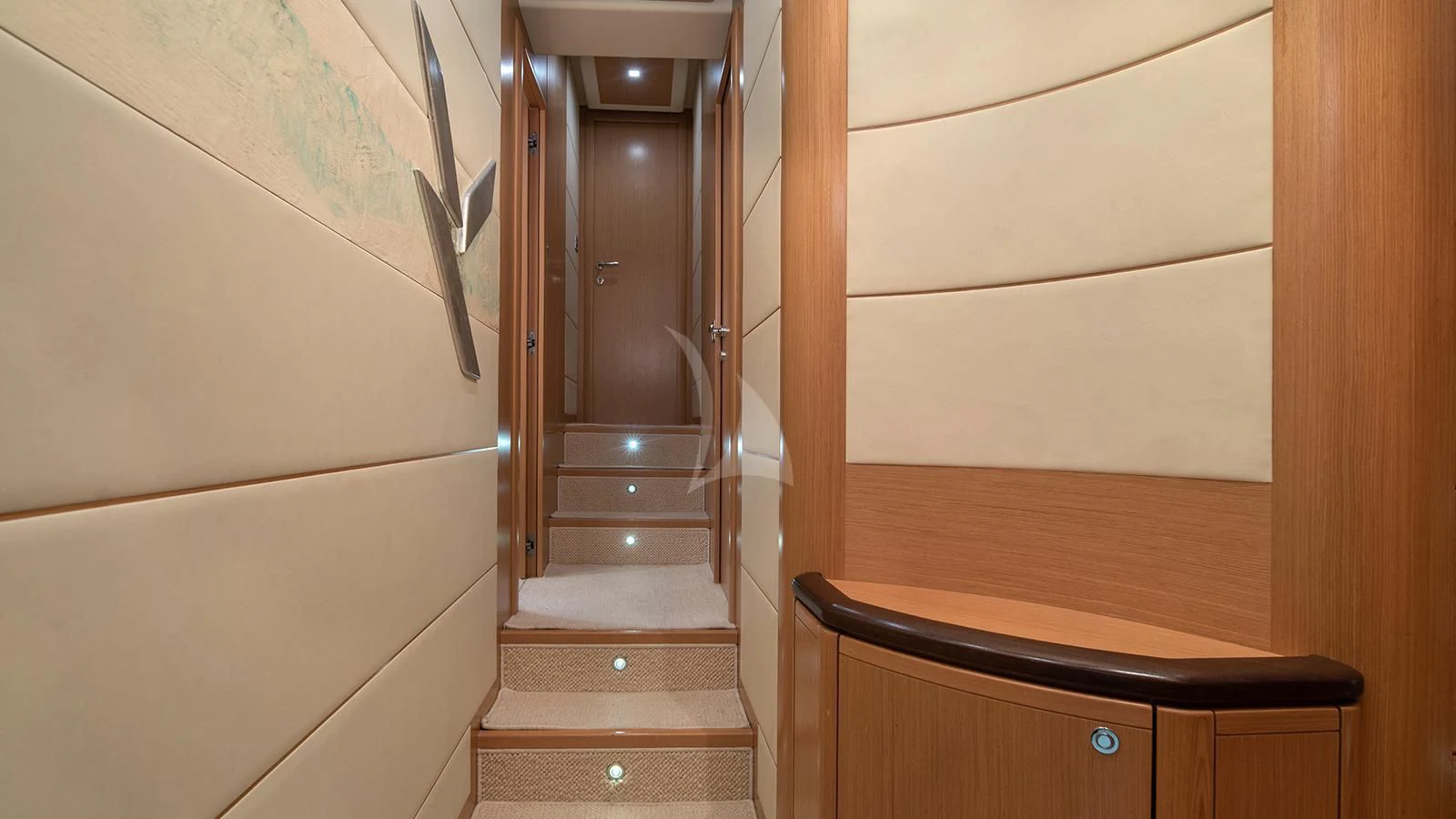 a wooden door with a mirror above it aboard MELI Yacht for Charter