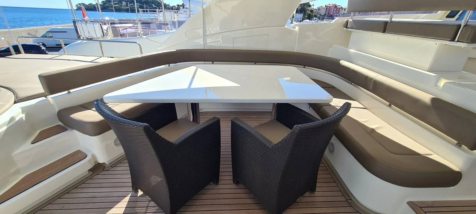 a couple of chairs on a deck aboard MELI Yacht for Charter
