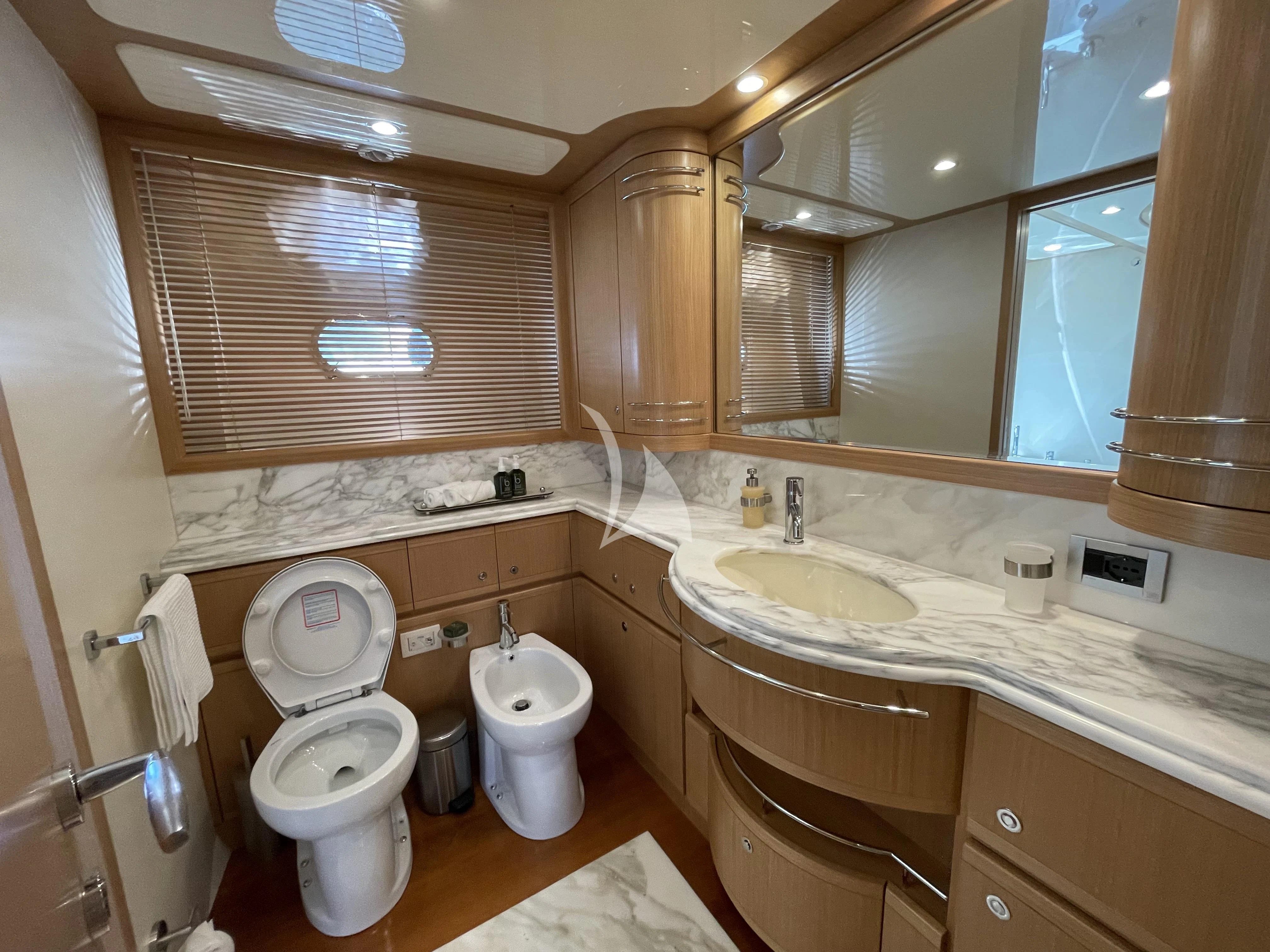 a bathroom with a toilet and sink aboard MELI Yacht for Charter