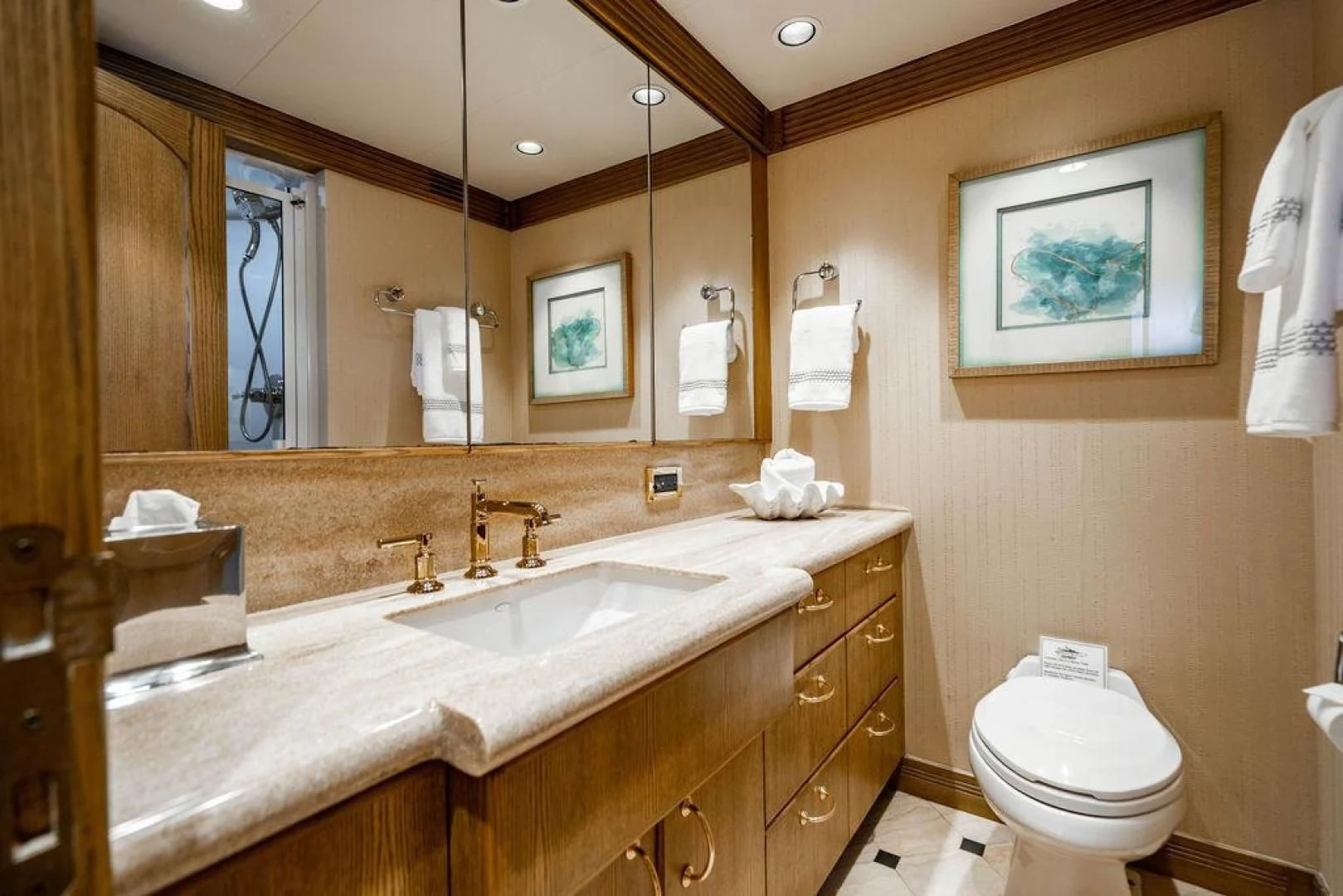 a bathroom with a large mirror aboard NORTH COAST 120 Yacht for Sale