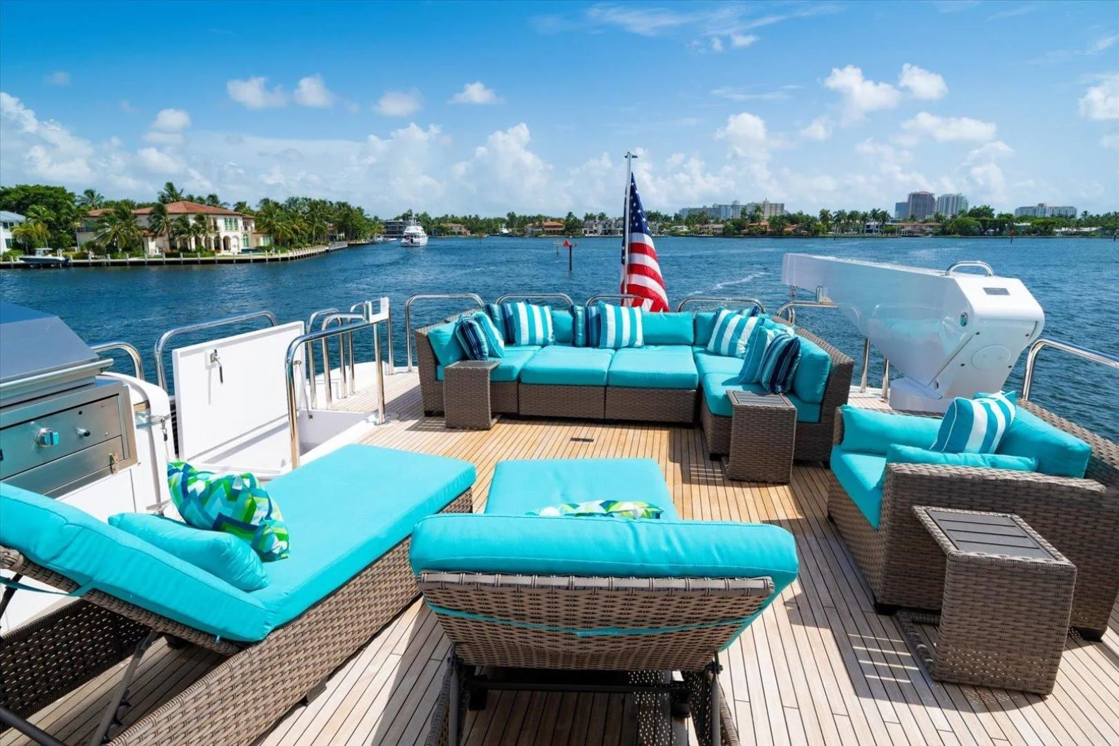 a boat with a flag on the deck aboard NORTH COAST 120 Yacht for Sale