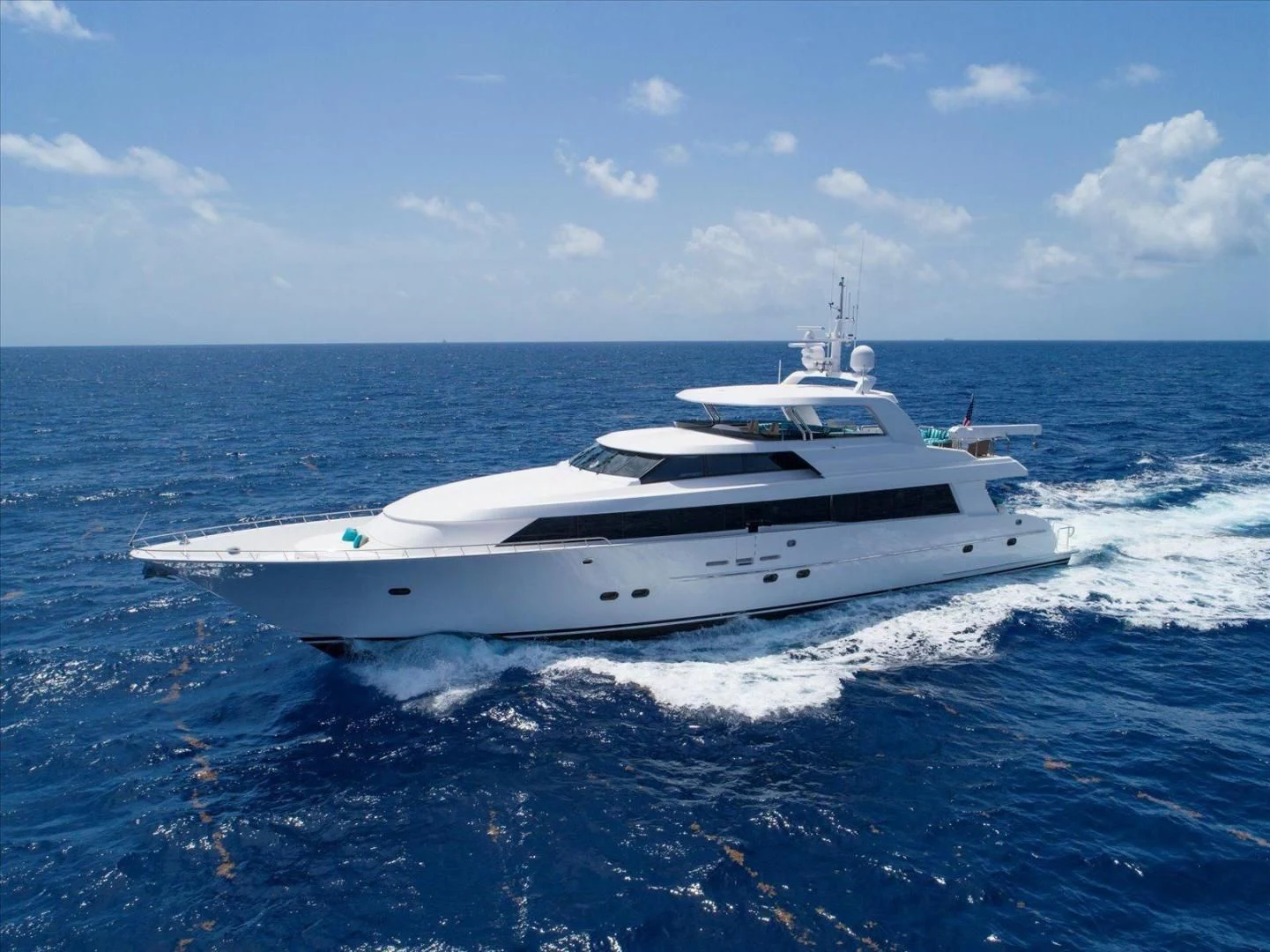 a white yacht on the water aboard NORTH COAST 120 Yacht for Sale