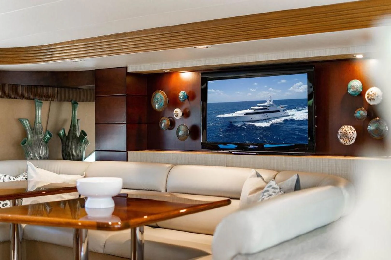 a tv on a wall aboard NORTH COAST 120 Yacht for Sale