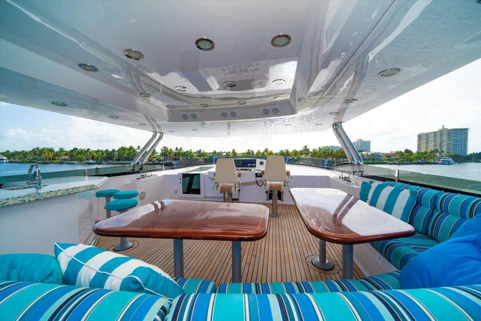 a boat with a table and chairs on it aboard NORTH COAST 120 Yacht for Sale
