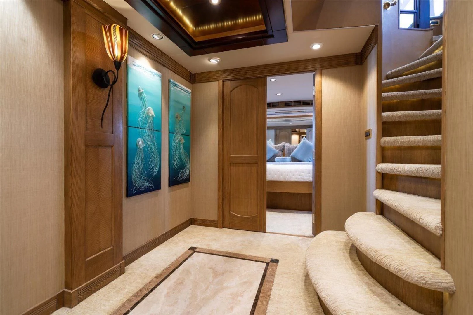 a room with a bed and a door aboard NORTH COAST 120 Yacht for Sale