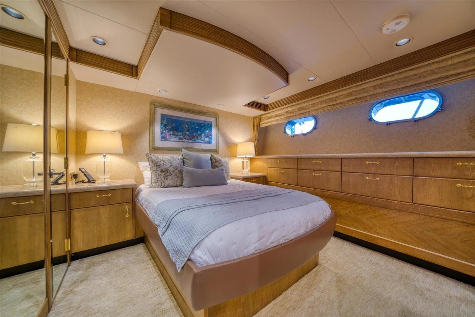 a bedroom with a bed and a desk aboard NORTH COAST 120 Yacht for Sale