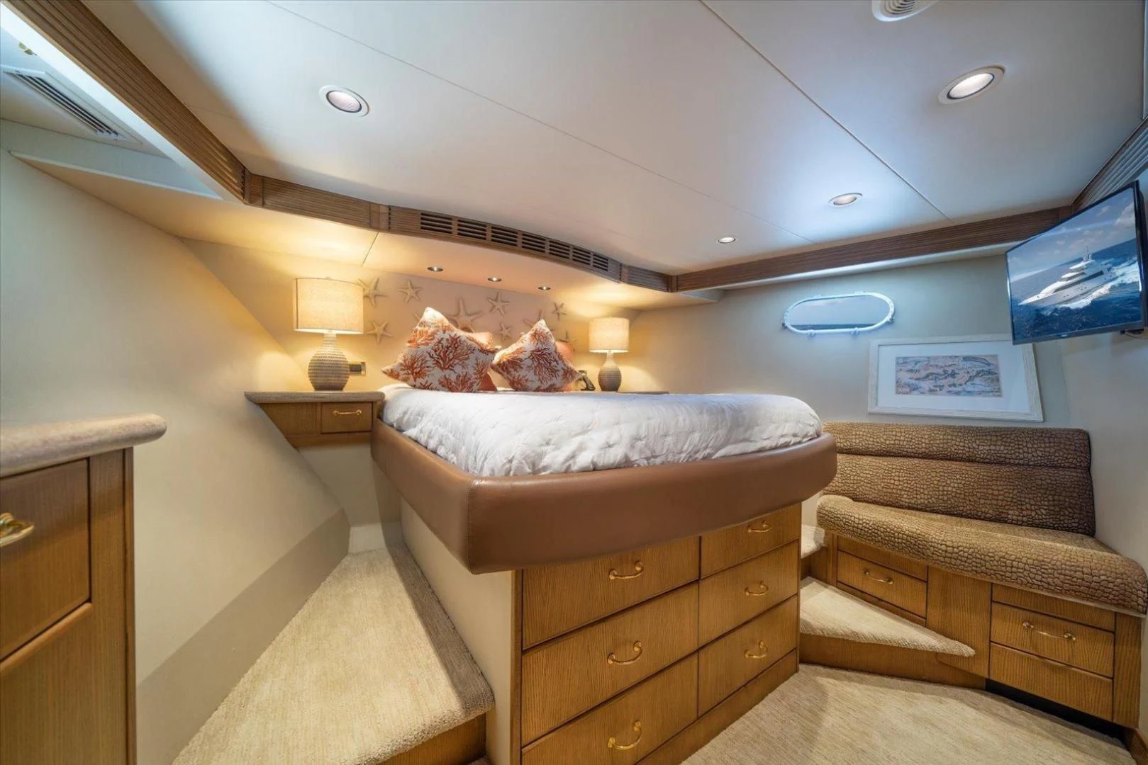 a bedroom with a bed and a couch aboard NORTH COAST 120 Yacht for Sale