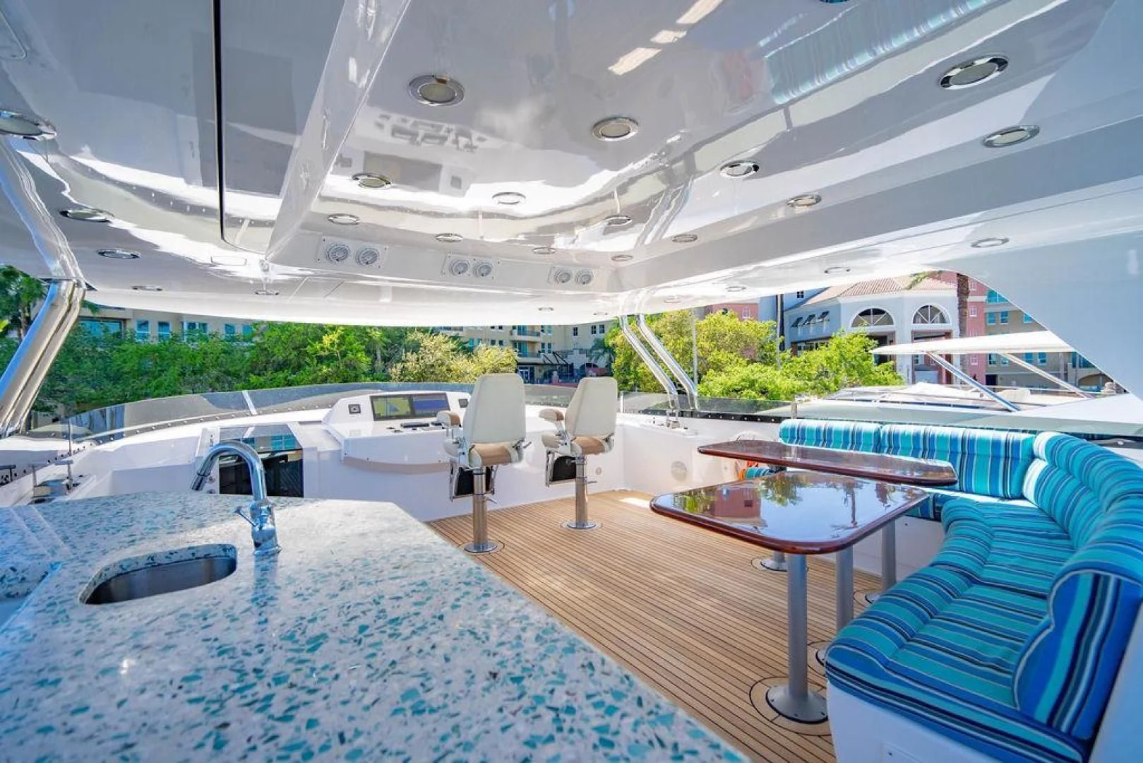 a boat with a table and chairs aboard NORTH COAST 120 Yacht for Sale