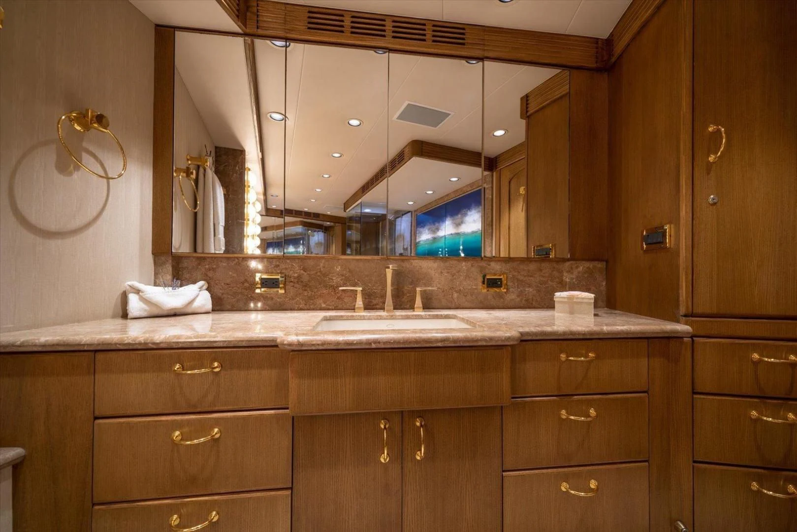a bathroom with a large mirror aboard NORTH COAST 120 Yacht for Sale
