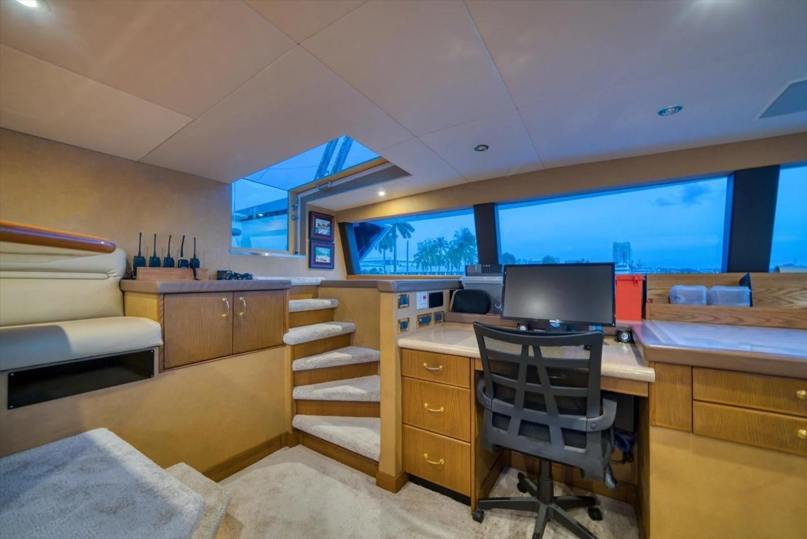 a room with a desk and a tv aboard NORTH COAST 120 Yacht for Sale