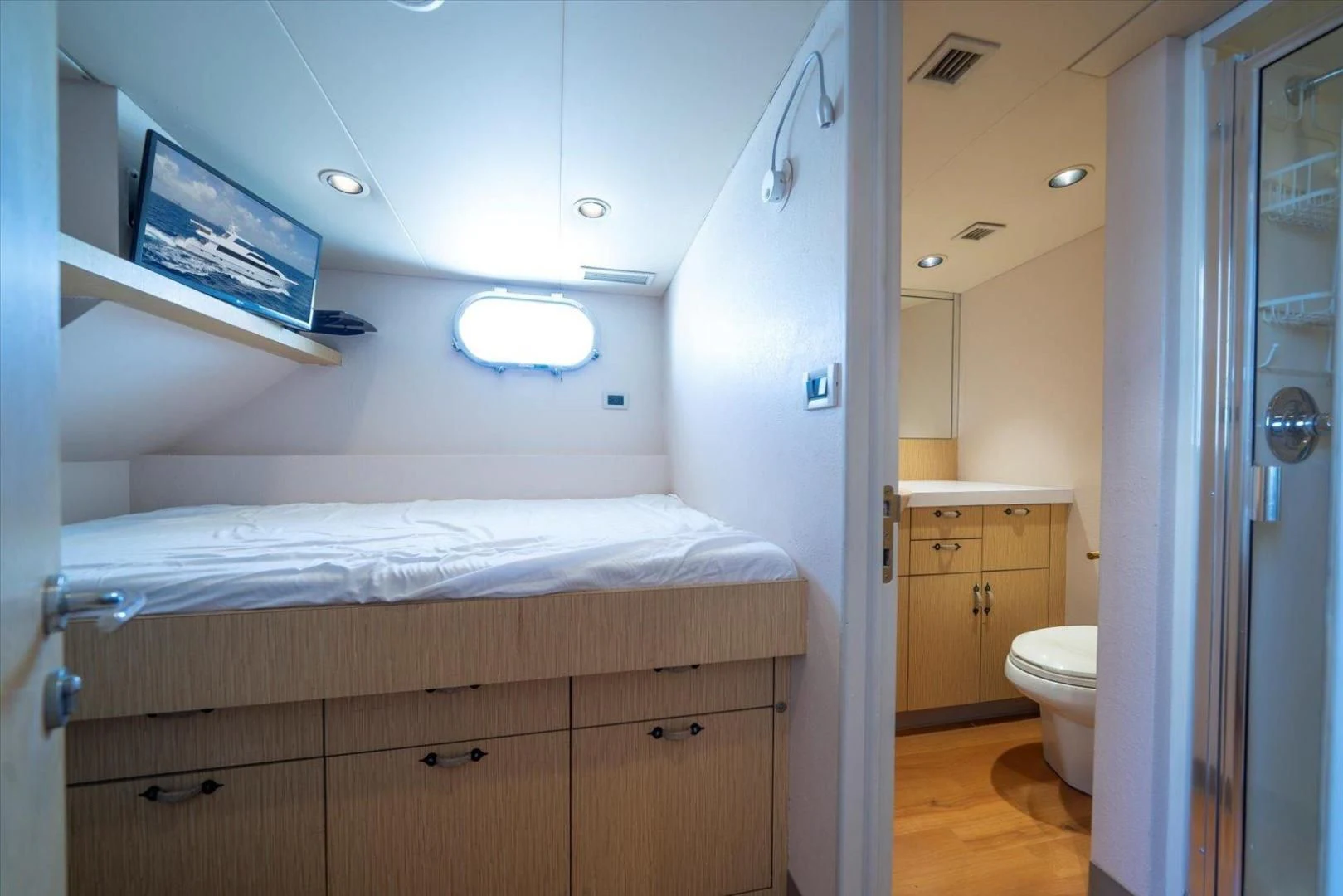 a bedroom with a bed aboard NORTH COAST 120 Yacht for Sale