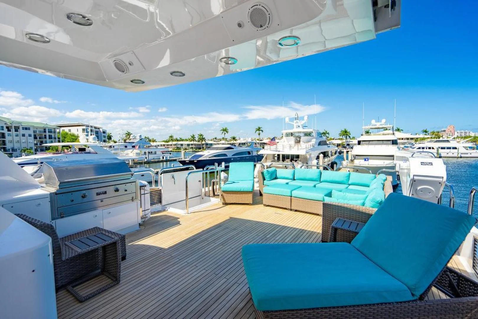 a deck with a view of a marina and boats aboard NORTH COAST 120 Yacht for Sale