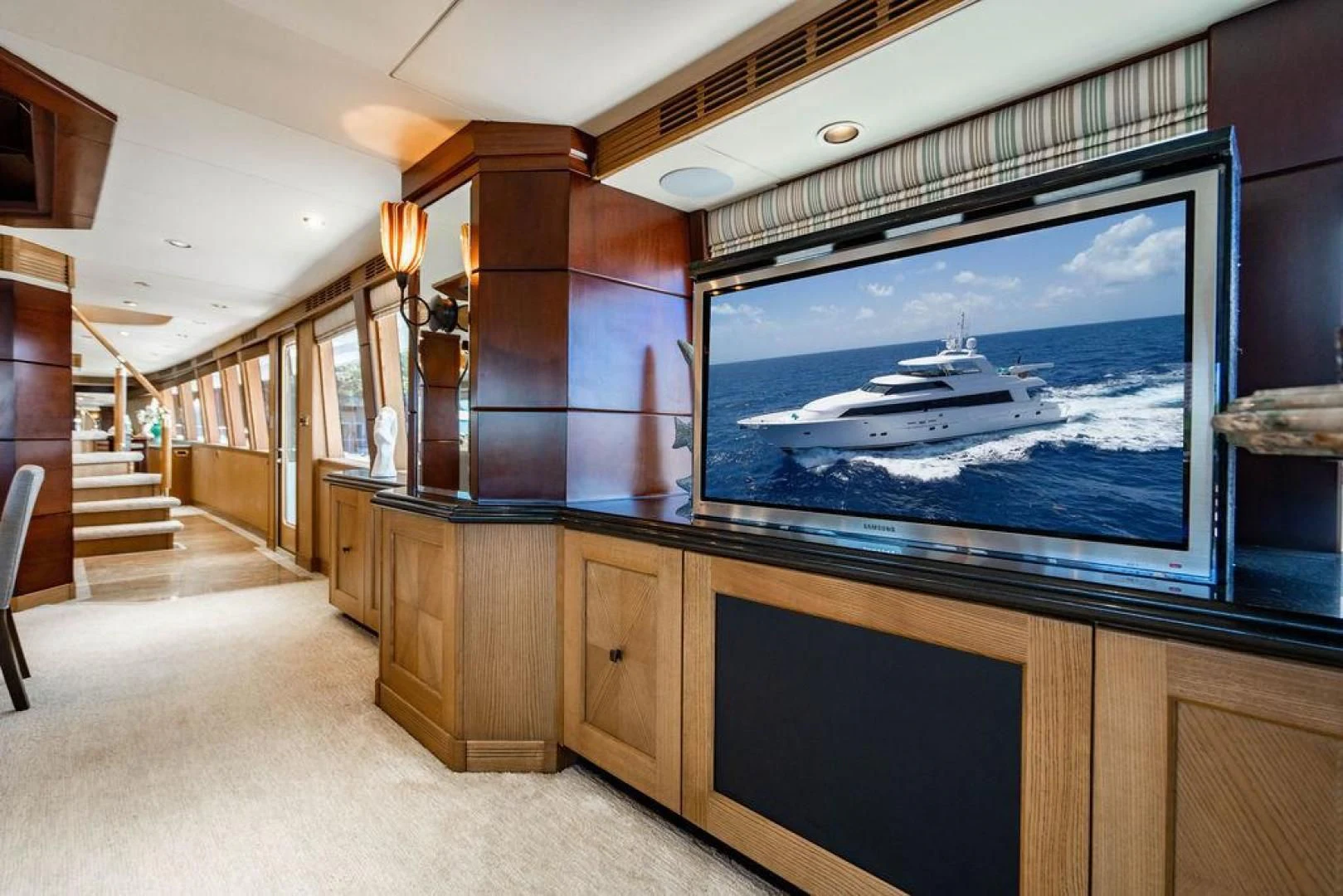 a room with a large tv aboard NORTH COAST 120 Yacht for Sale