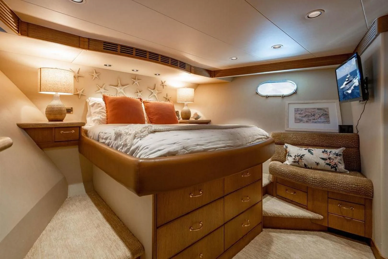 a bedroom with a bed and a television aboard NORTH COAST 120 Yacht for Sale