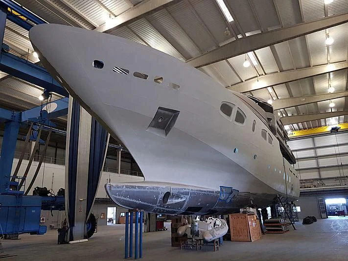 a large airplane in a hangar aboard CROCUS Yacht for Sale