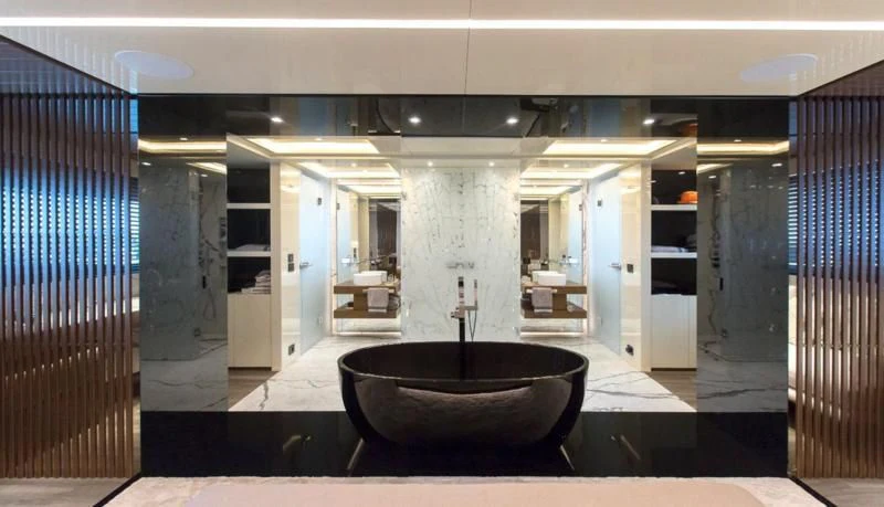 a large bathroom with a large jacuzzi aboard CROCUS Yacht for Sale