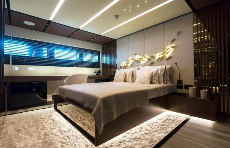 a room with a bed and a large window aboard CROCUS Yacht for Sale
