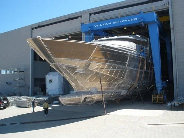 a large metal structure with a few people standing around it aboard CROCUS Yacht for Sale