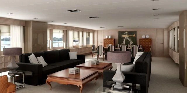 a living room with a black couch and a coffee table aboard CROCUS Yacht for Sale