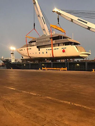 a large ship docked at a pier aboard CROCUS Yacht for Sale