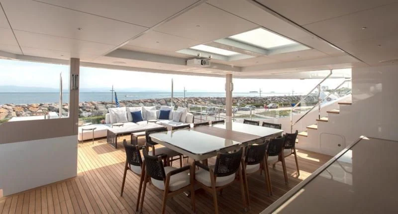 a room with a table and chairs aboard CROCUS Yacht for Sale