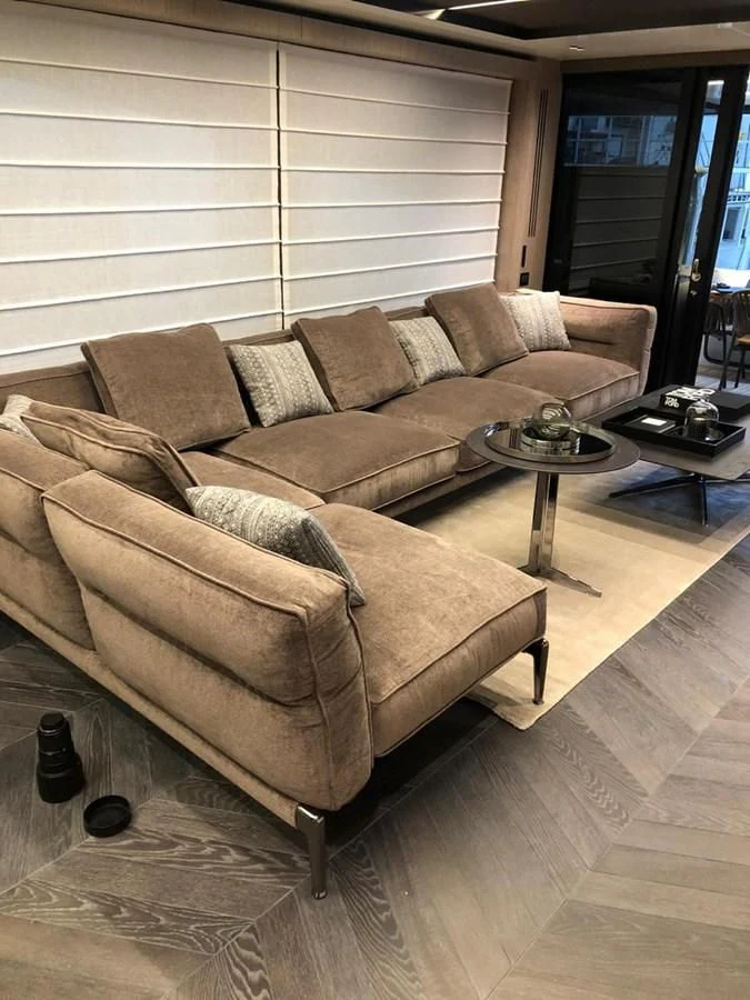 a couch in a living room aboard SETTANTOTTO 78 Yacht for Sale