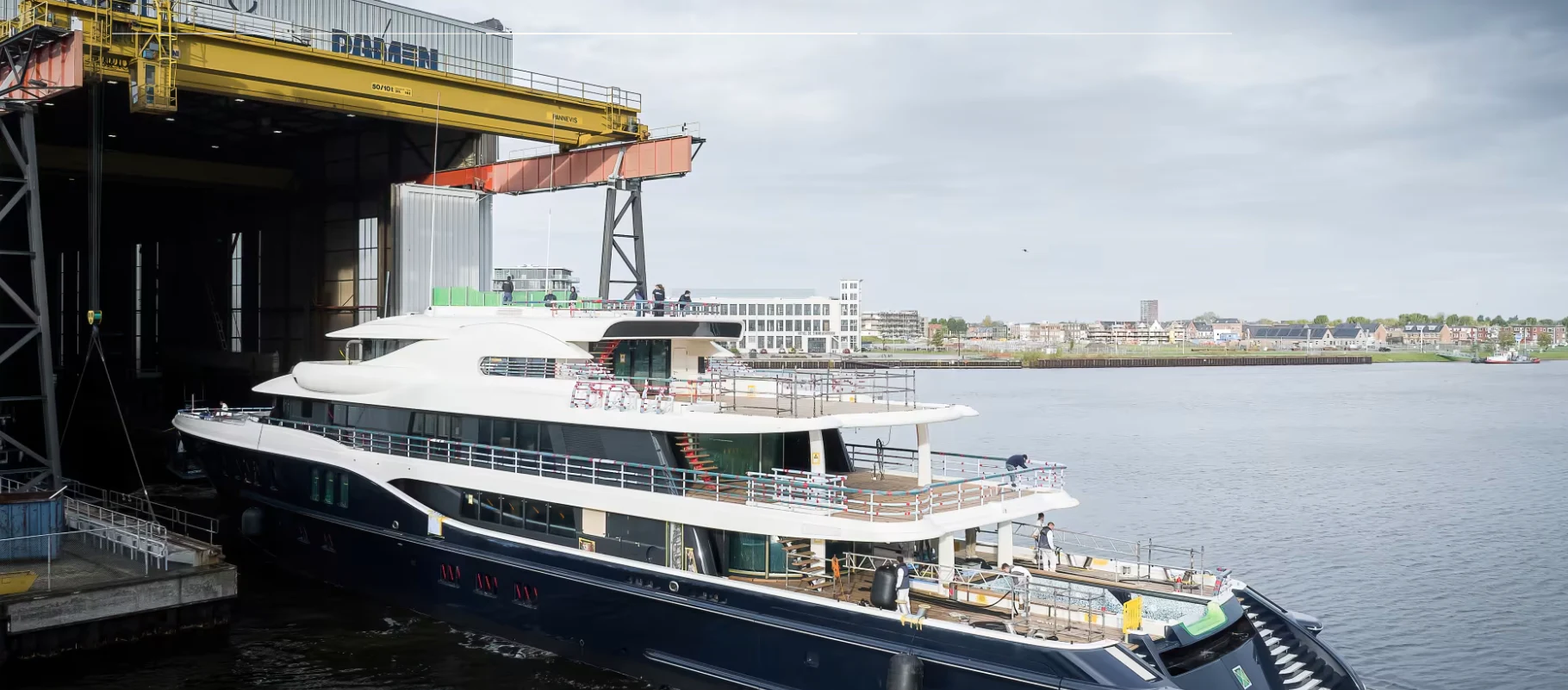 a large boat docked at a pier aboard NOME Yacht for Sale