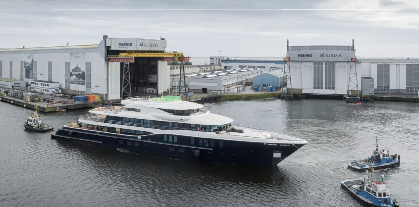 a large boat is parked in the water aboard NOME Yacht for Sale