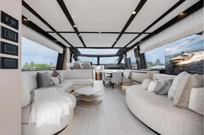 a large living room with a large window aboard SUNSET 8 Yacht for Sale
