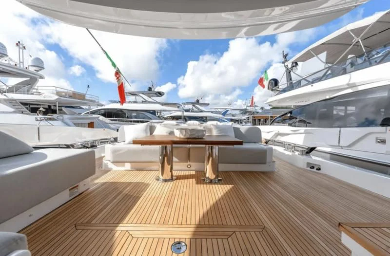 a room with a table and chairs aboard SUNSET 8 Yacht for Sale
