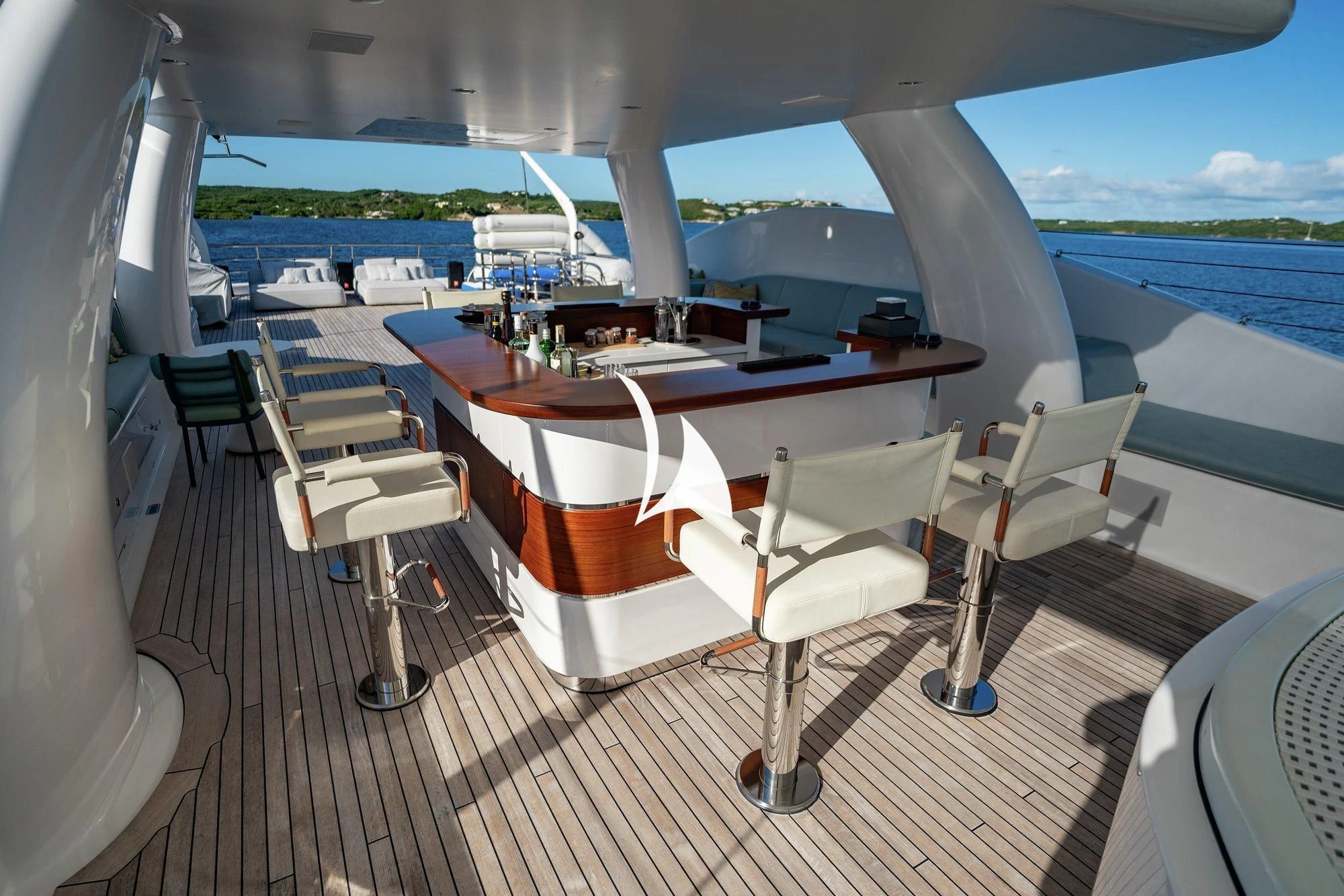 a table with chairs on it aboard NOMAD Yacht for Sale