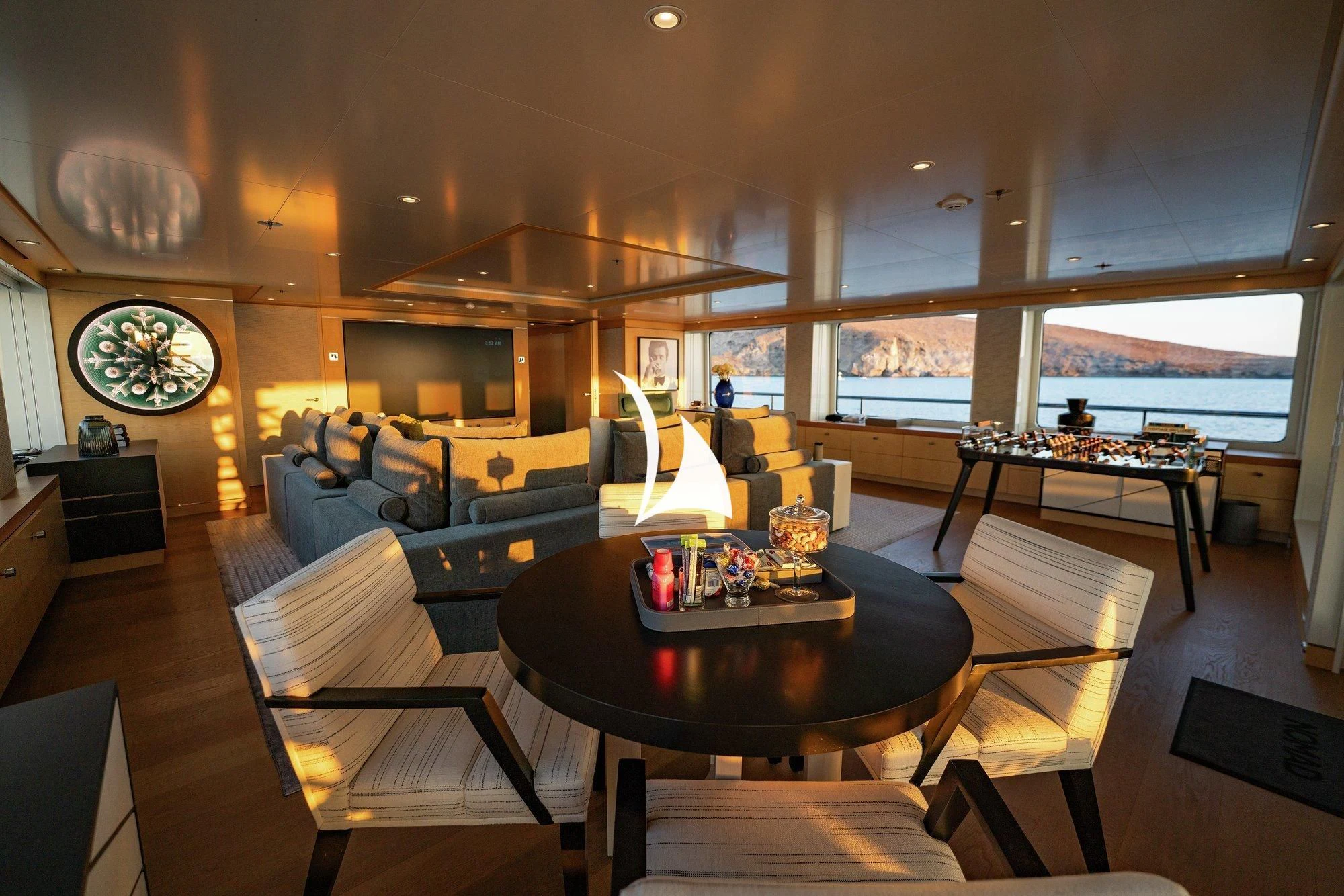 a living room with a large window aboard NOMAD Yacht for Sale