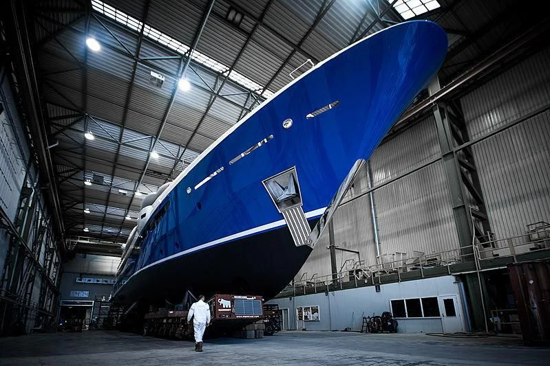 a person standing in a warehouse aboard NOMAD Yacht for Sale