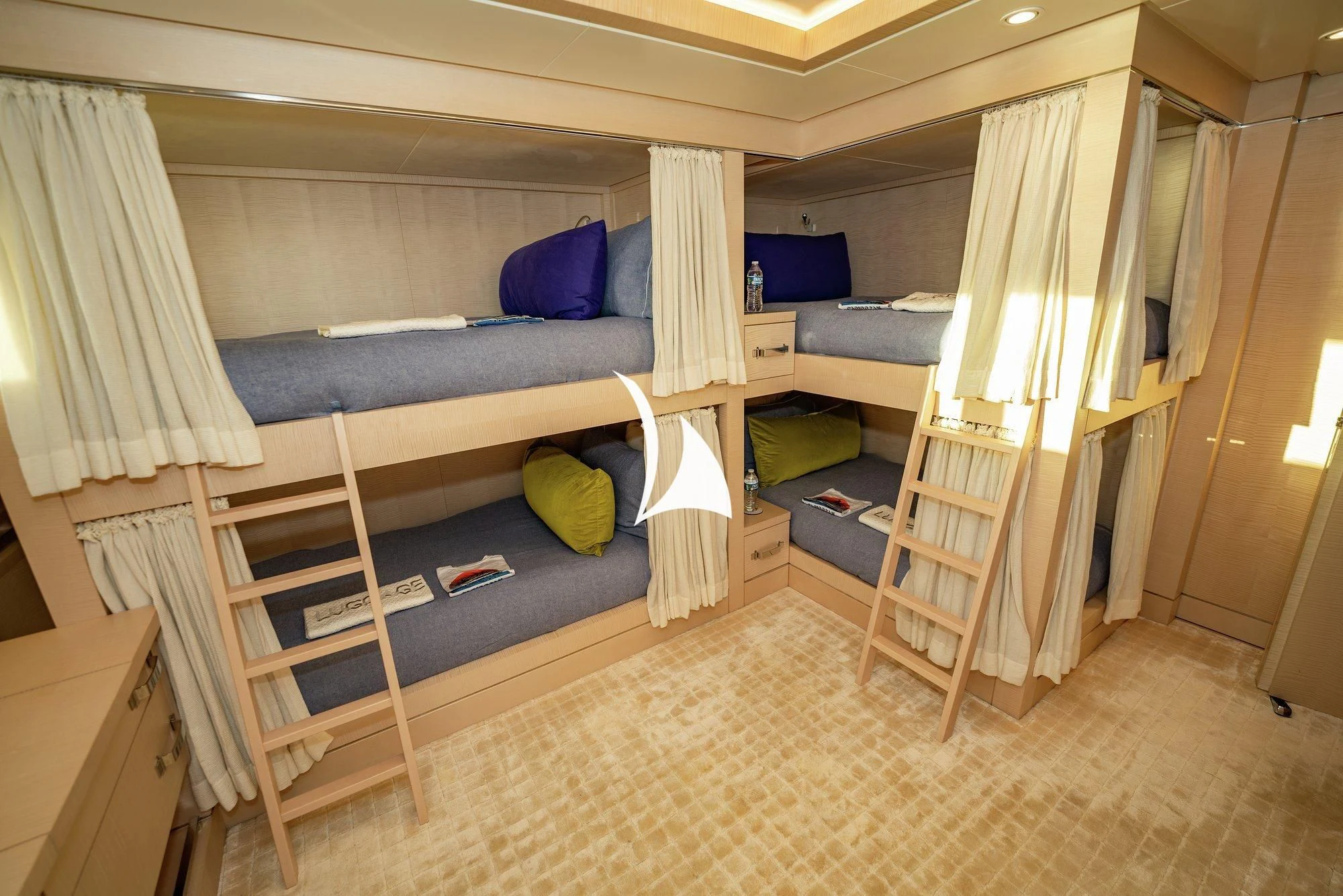 a room with bunk beds aboard NOMAD Yacht for Sale