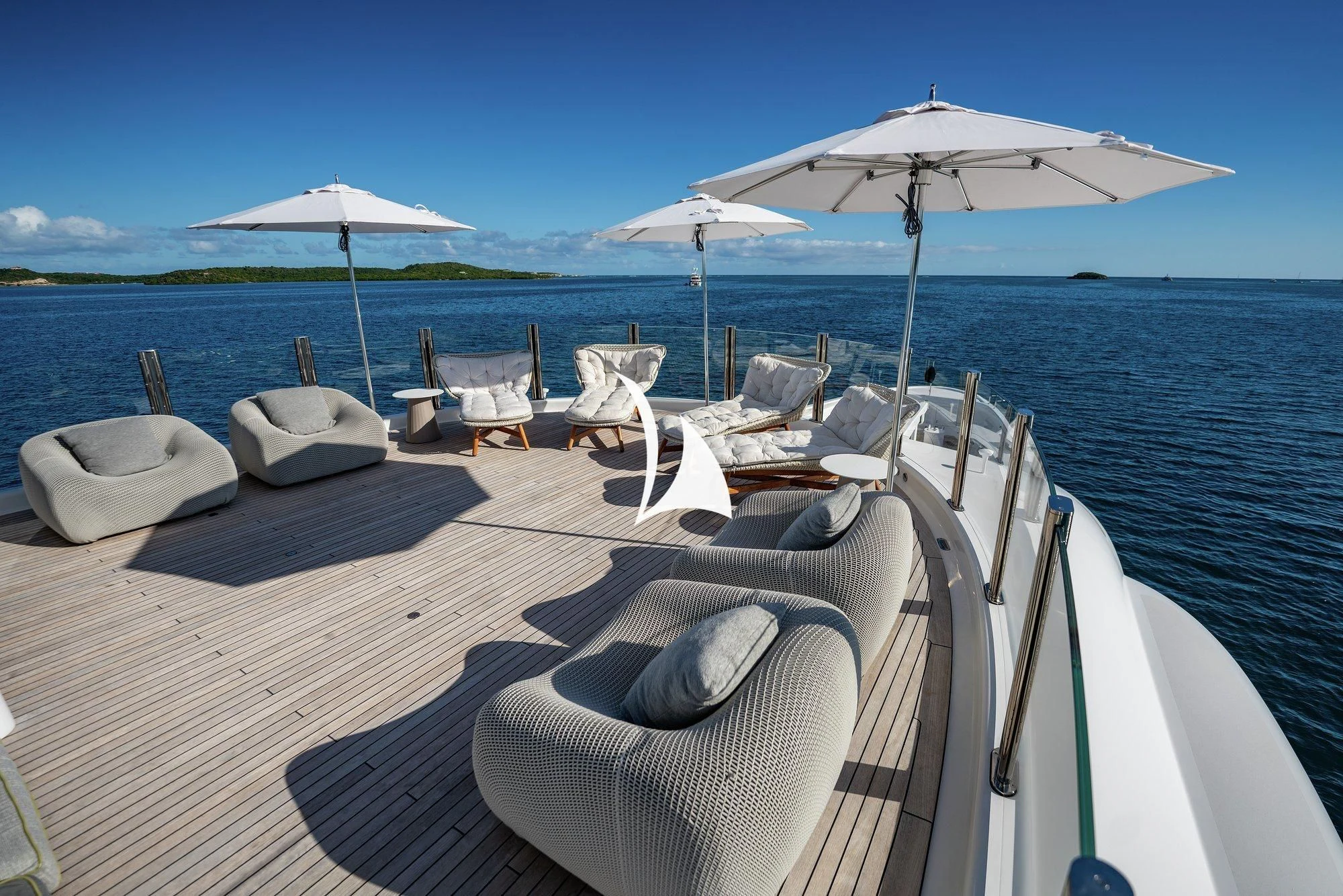 a boat with chairs and umbrellas on a beach aboard NOMAD Yacht for Sale
