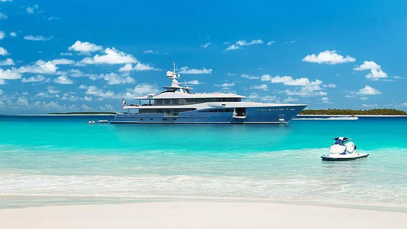 a large ship in the water aboard NOMAD Yacht for Sale