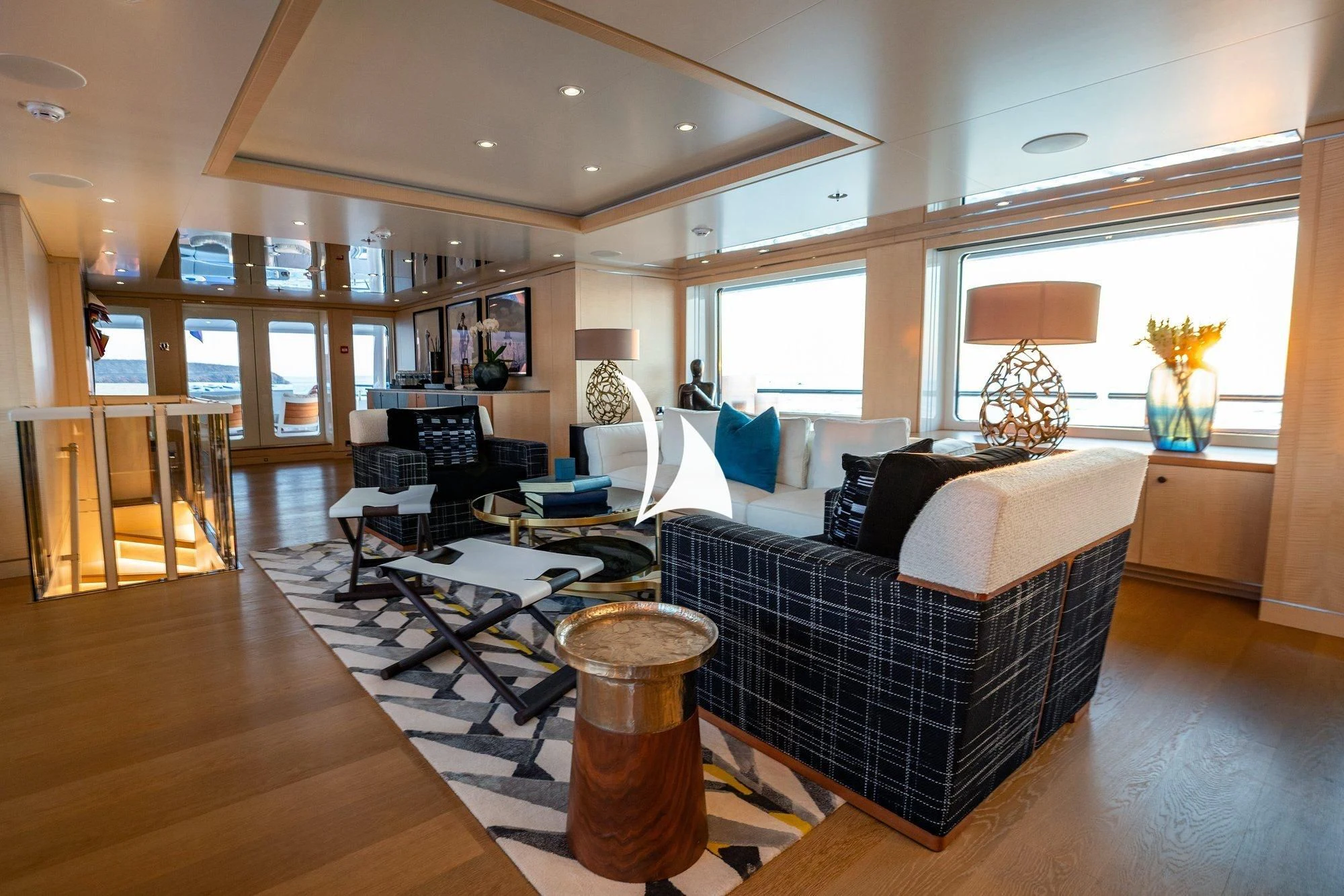 a living room with a couch and a coffee table aboard NOMAD Yacht for Sale
