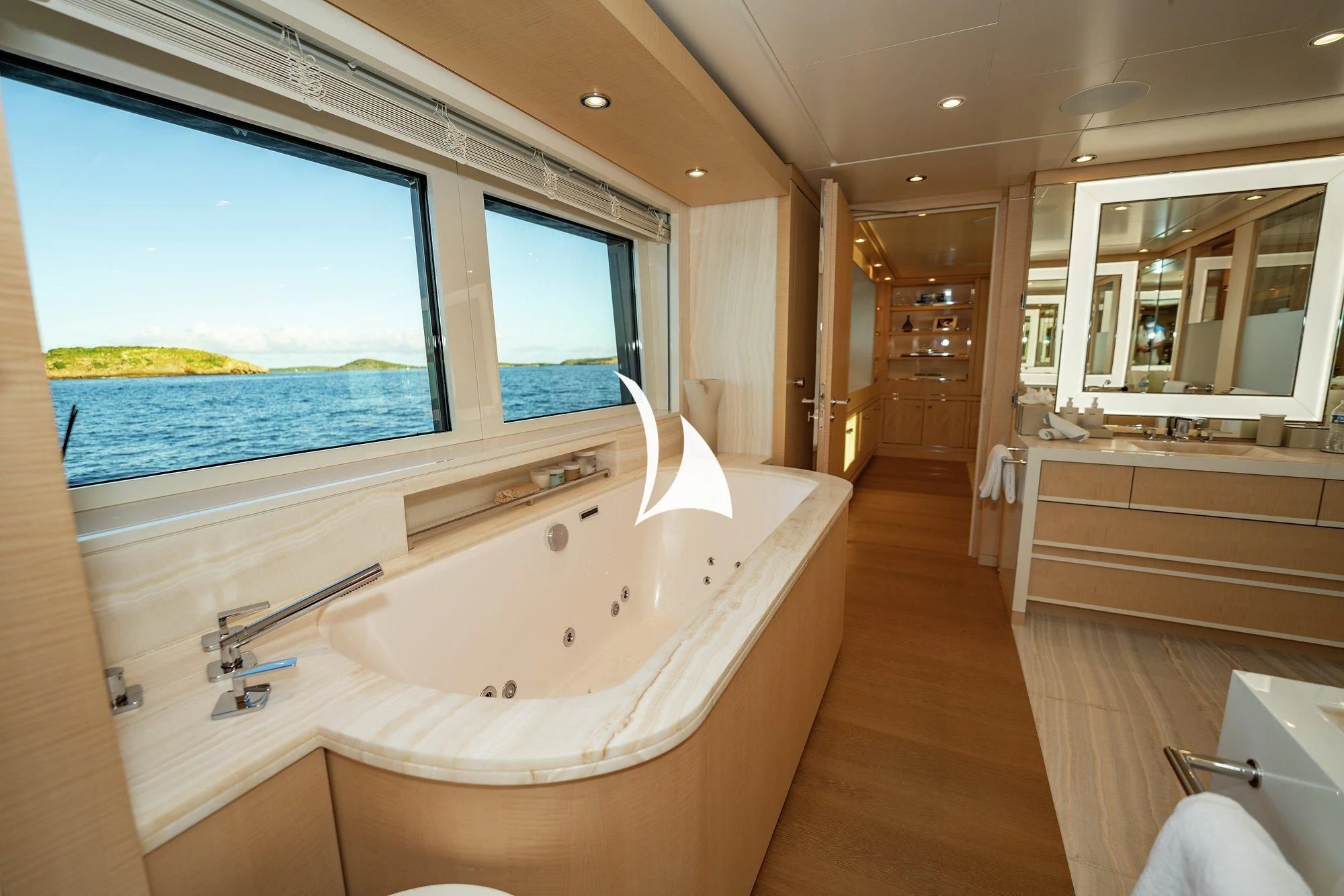 a large bathroom with a large jacuzzi tub aboard NOMAD Yacht for Sale