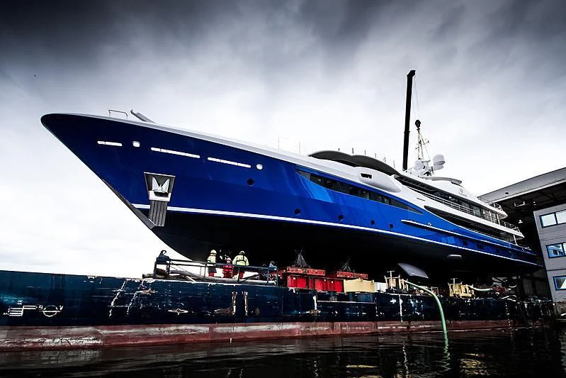 a large blue and white boat aboard NOMAD Yacht for Sale
