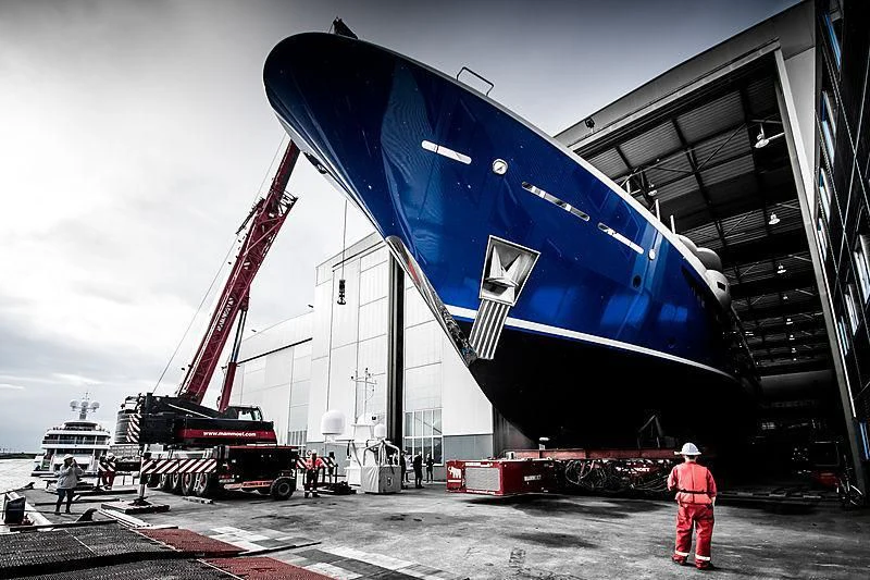 a large blue and black airplane aboard NOMAD Yacht for Sale