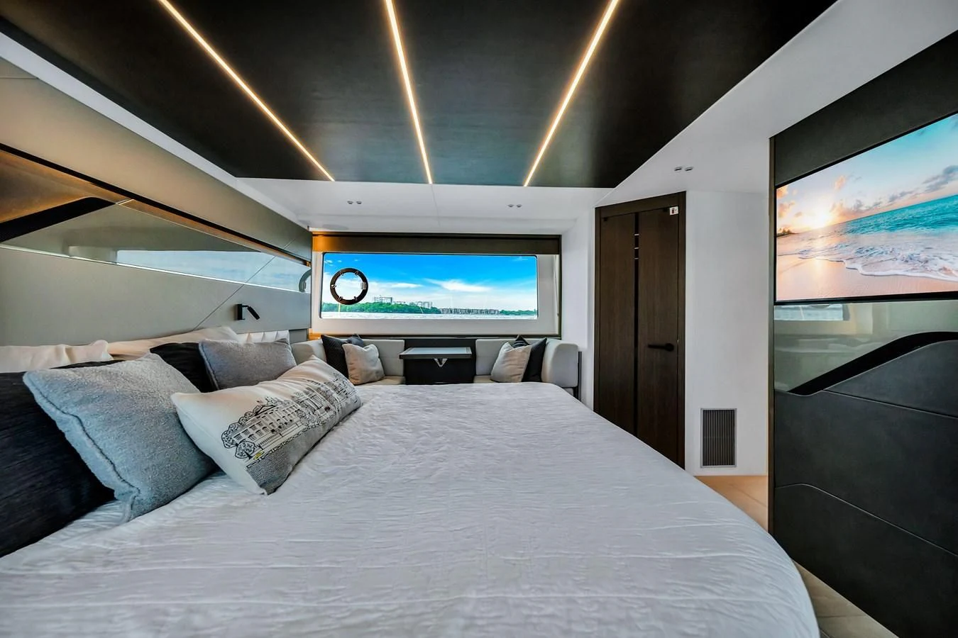 a bed with a large screen aboard BELLOW DECK Yacht for Sale
