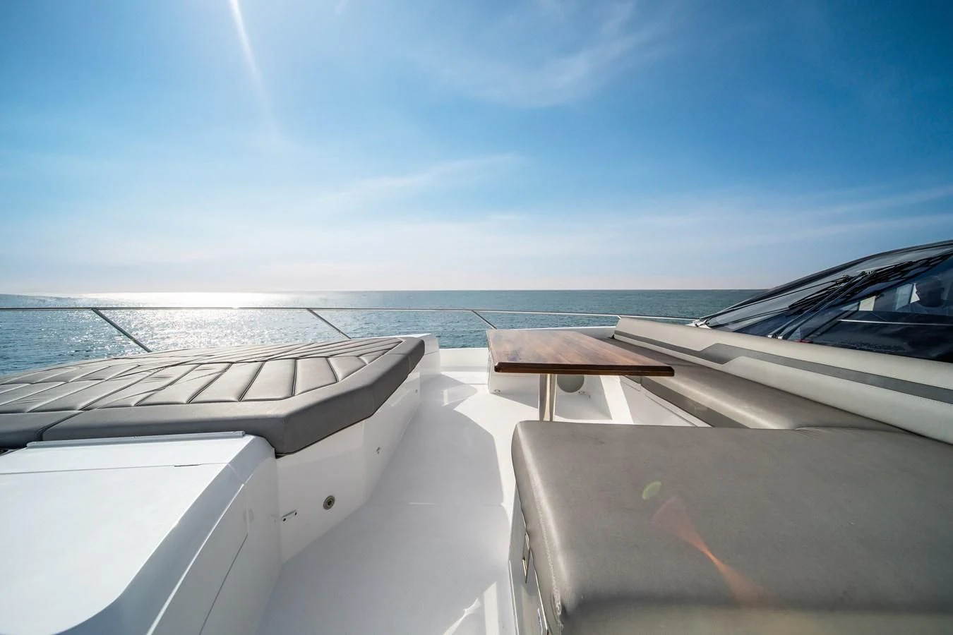 a deck with a view of the ocean and the ocean aboard BELLOW DECK Yacht for Sale